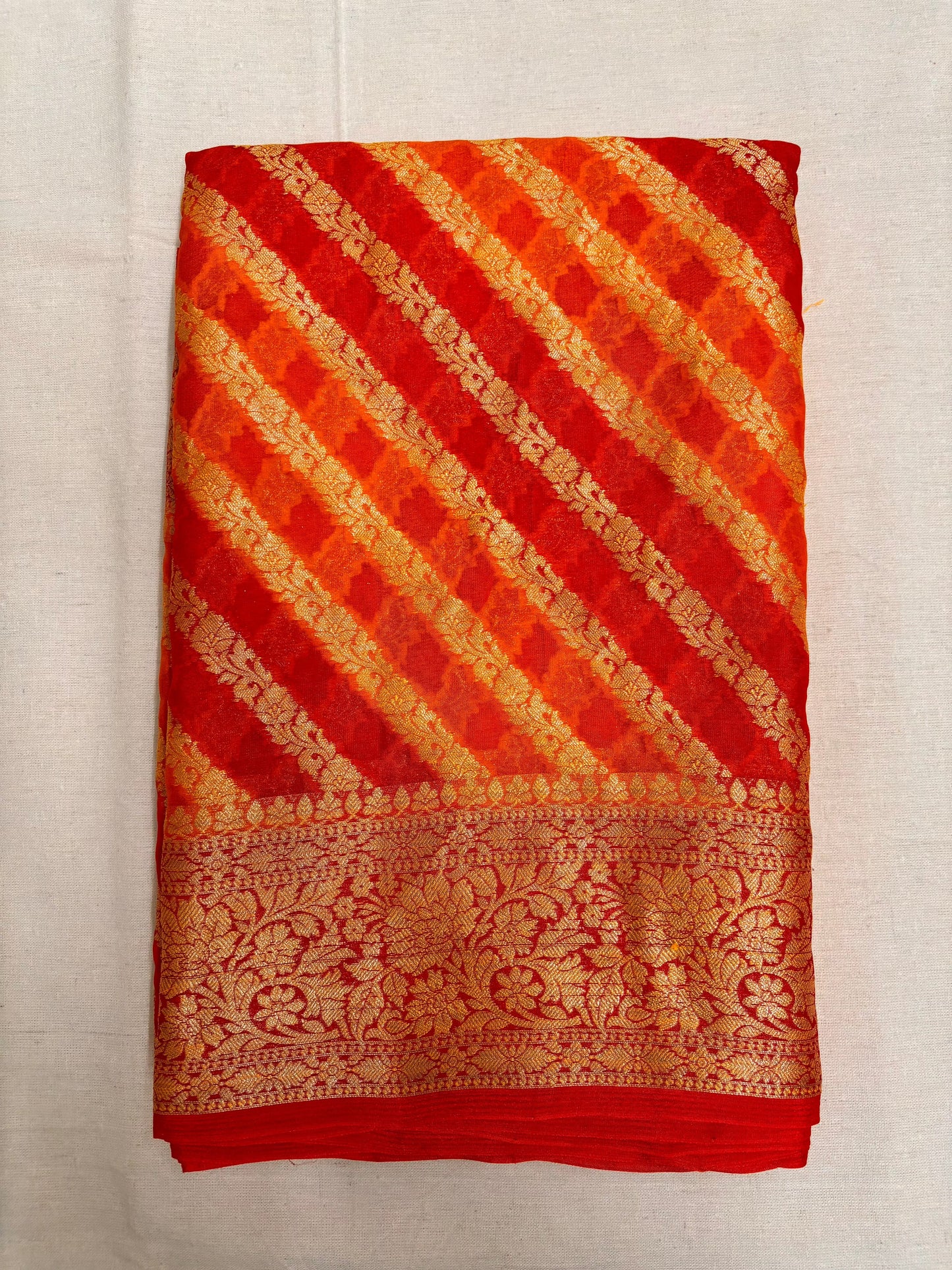 Arav Ethnics Leheriya Khaddi Georgette Benarasi